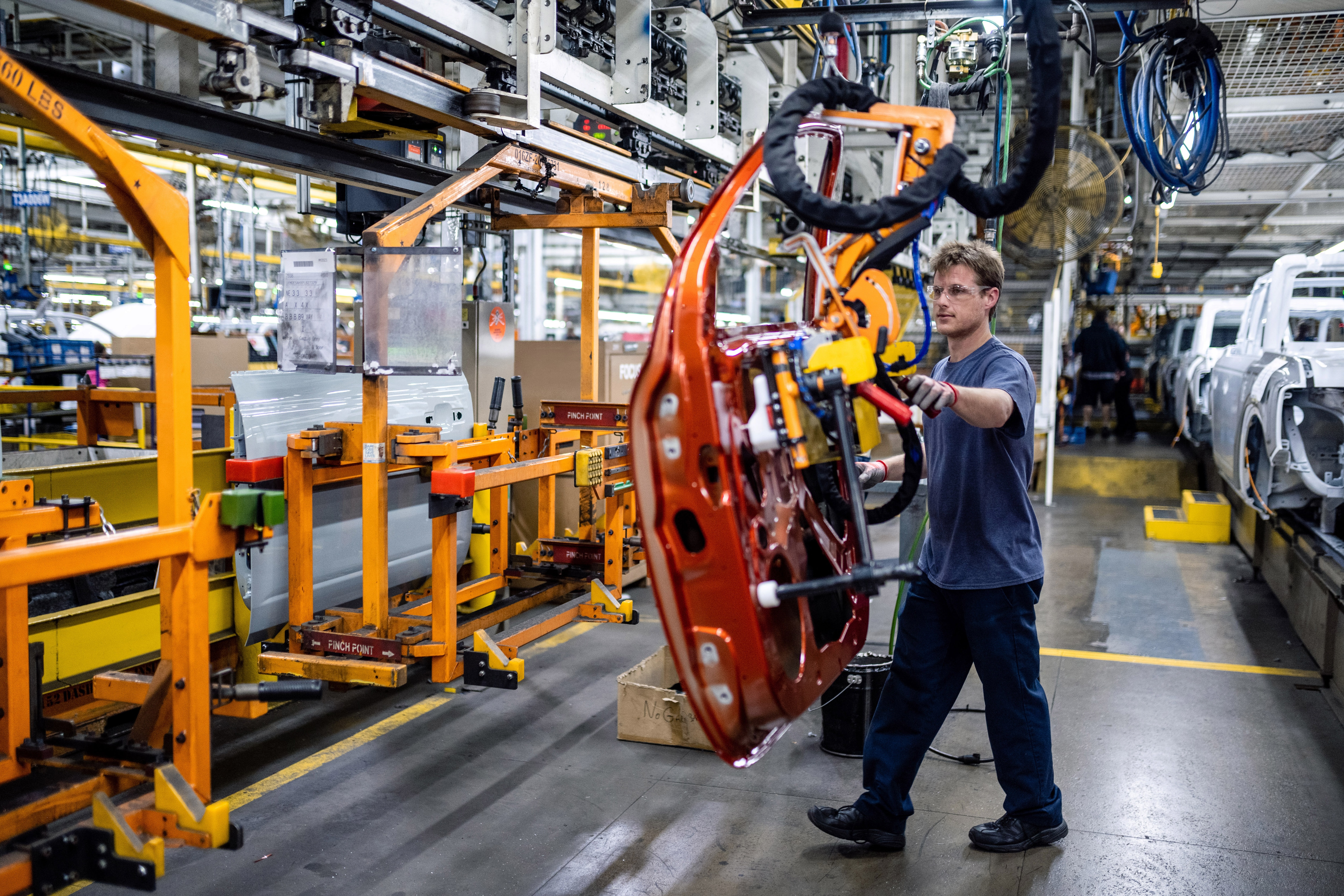 Daniel Bak helps assemble a Ranger pickup at Michigan Assembly Plant.